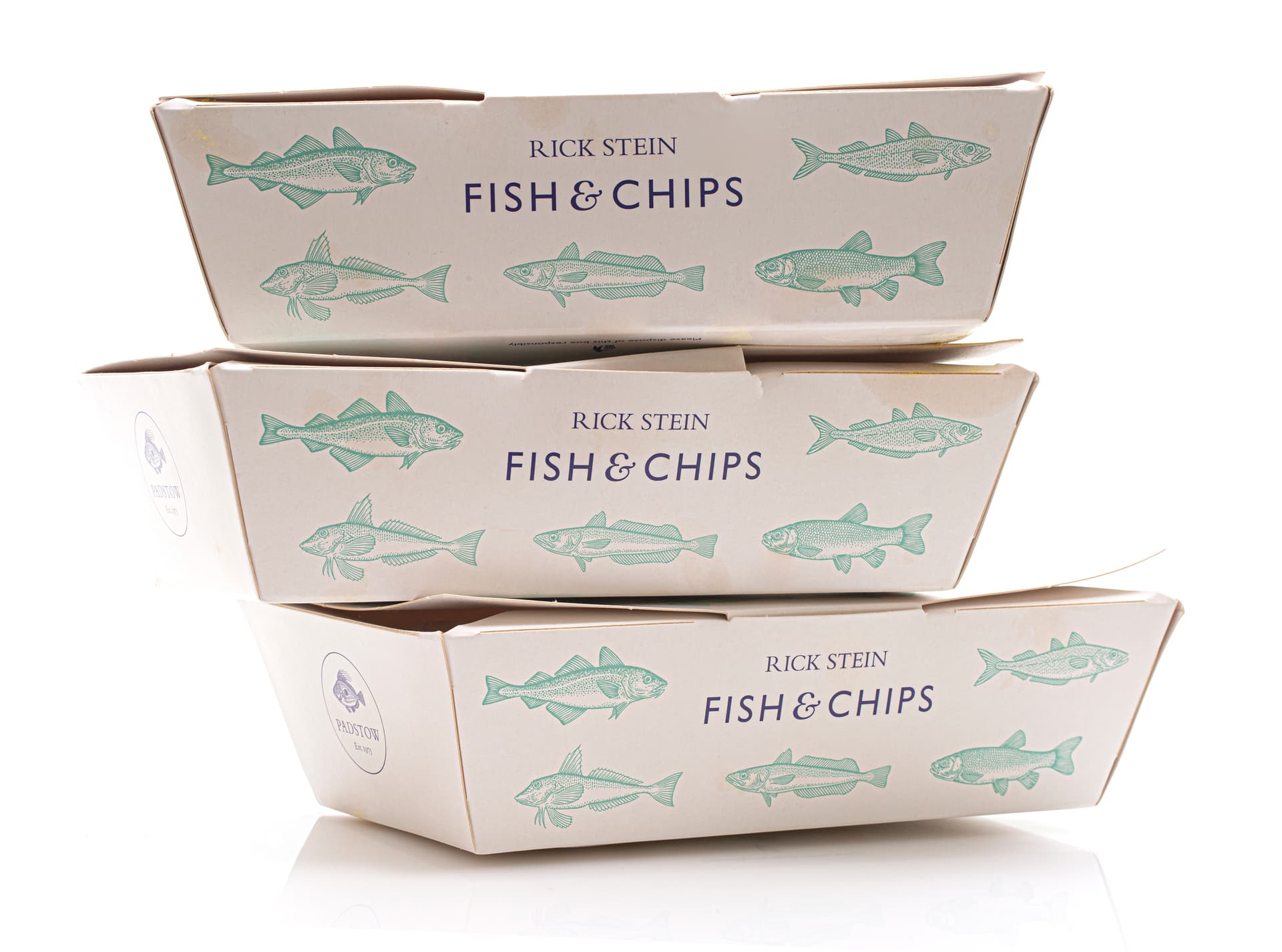 Stack of three Rick Stein Fish & Chips takeaway boxes with fish illustrations on white background.