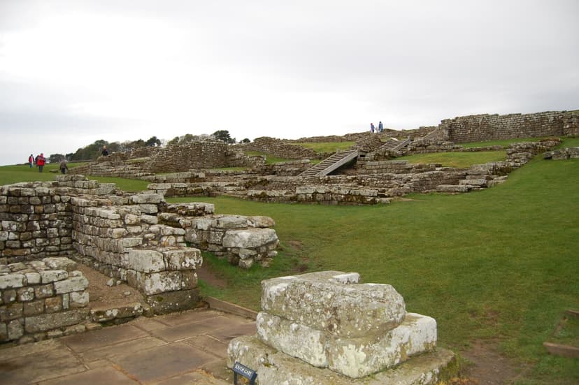 Housesteads Roman Fort stone ruins and South Gate with grassy landscape